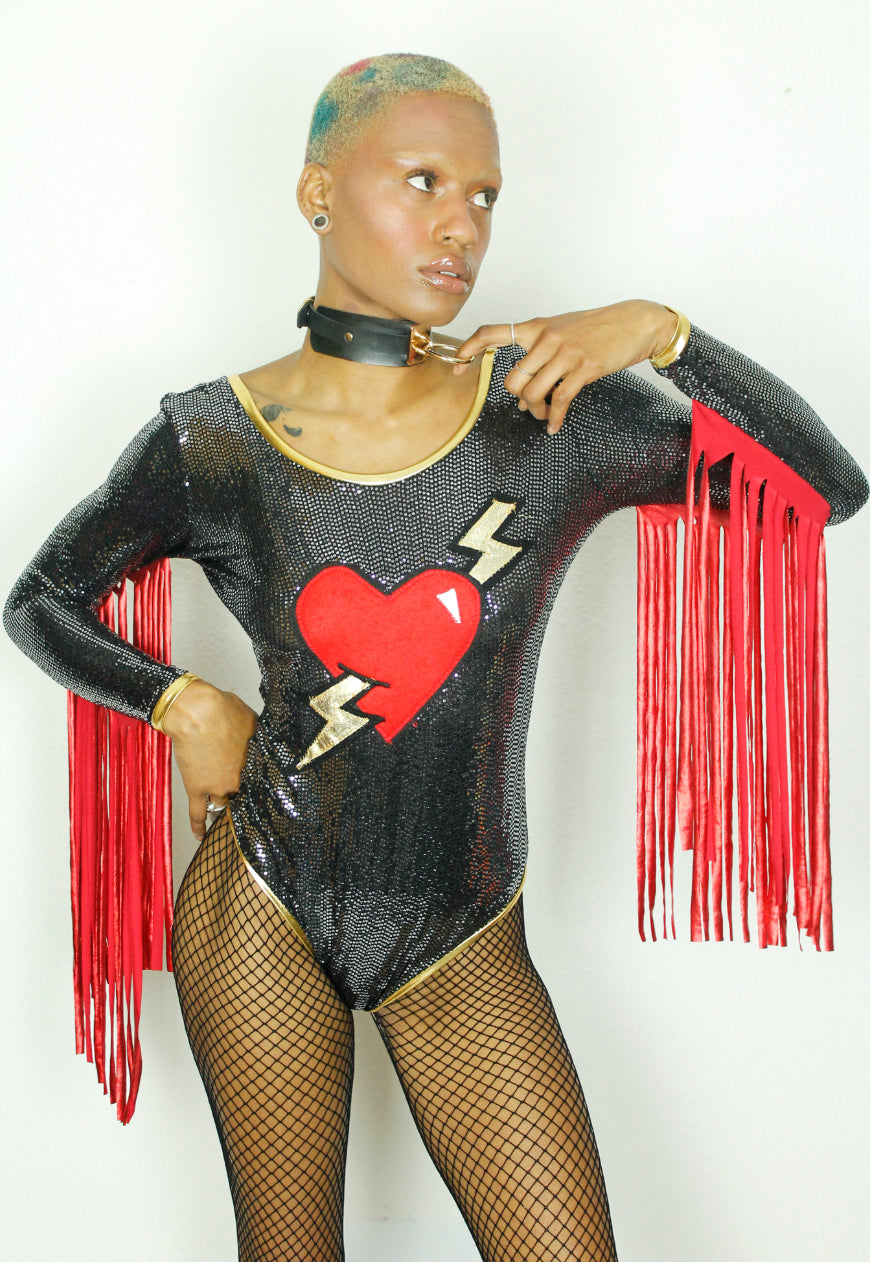 LOVE LIES BLEEDING - Sequin bodysuit heart and lightening bolt applique and fringe