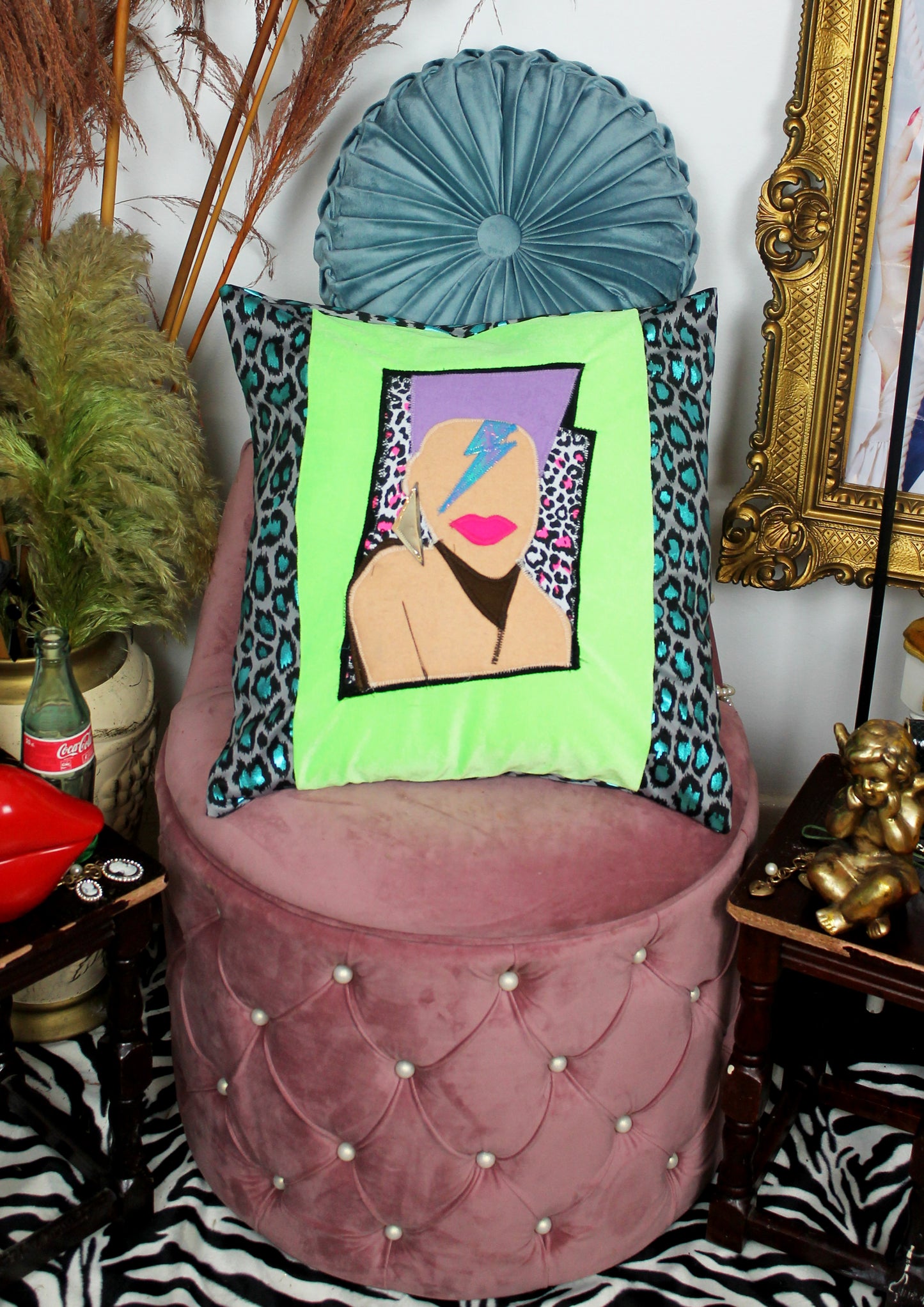 Stardust - handmade throw cushion in neon green and blue leopard print with 80’s face appliqué.