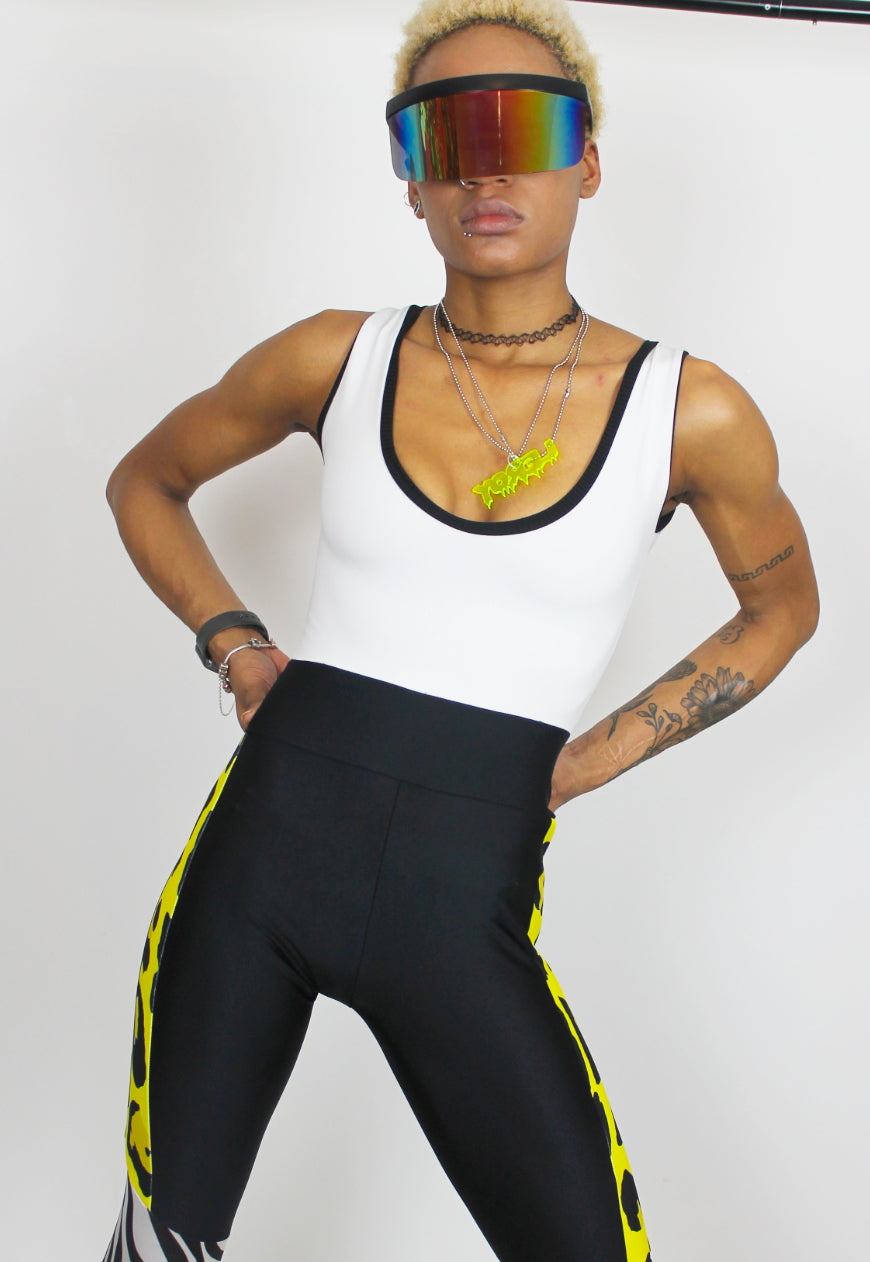 Dimepiece - Black and white jumpsuit with zebra and yellow leopard panel.
