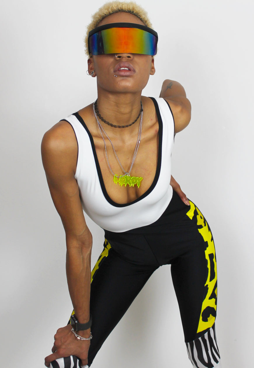 Dimepiece - Black and white jumpsuit with zebra and yellow leopard panel.
