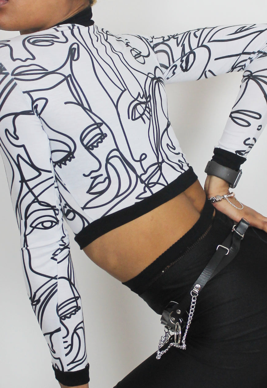 Face Off - Long sleeved white crop top with abstract face print