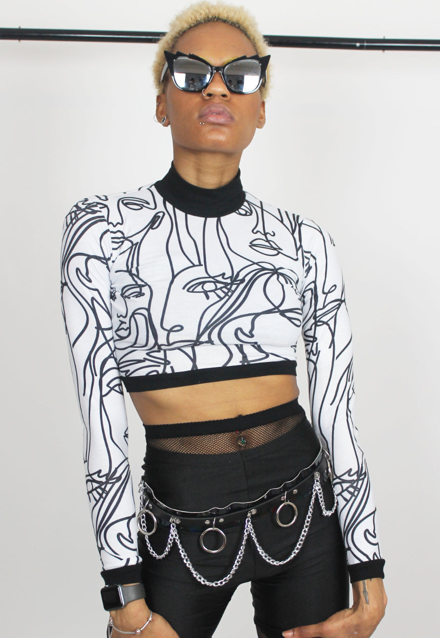 Face Off - Long sleeved white crop top with abstract face print