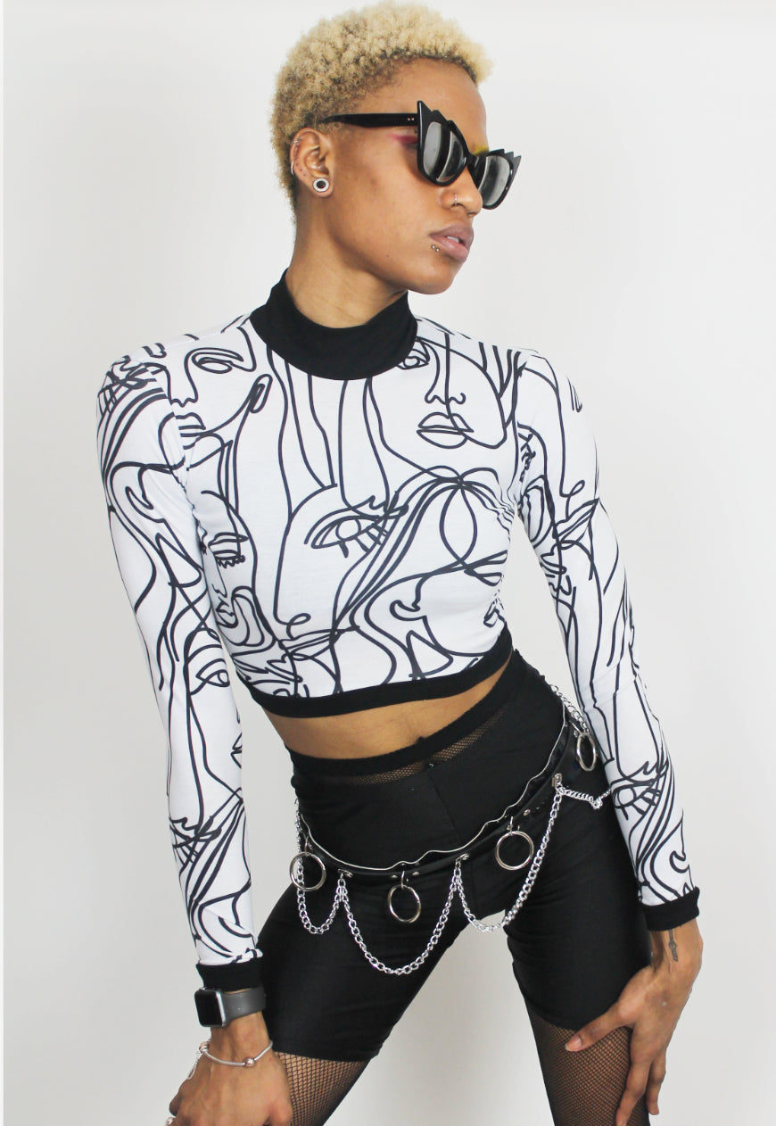 Face Off - Long sleeved white crop top with abstract face print