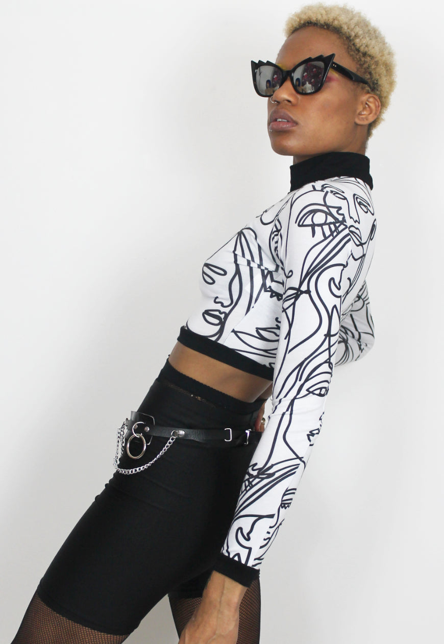 Face Off - Long sleeved white crop top with abstract face print