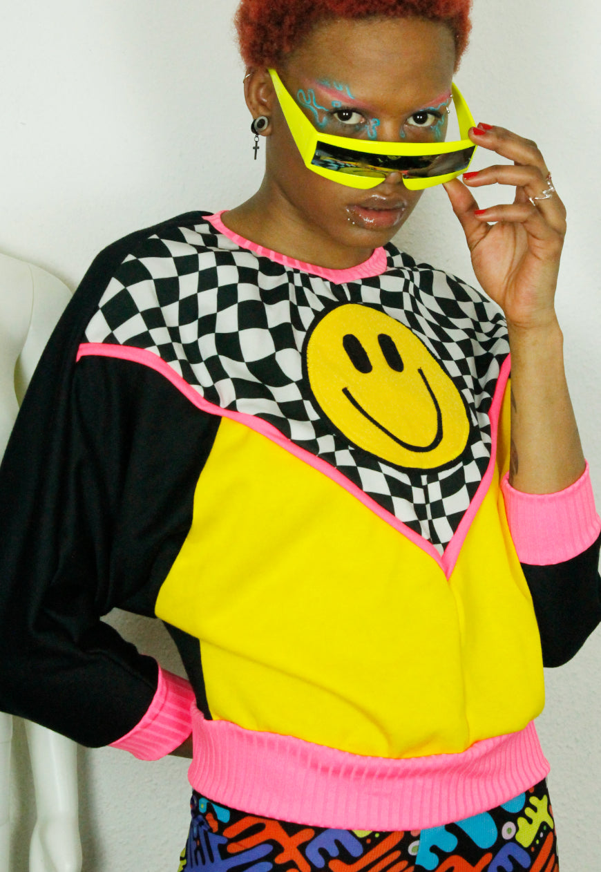 FREEDOM Checkerboard and yellow batwing sweat with 90’s smile detail and neon trim