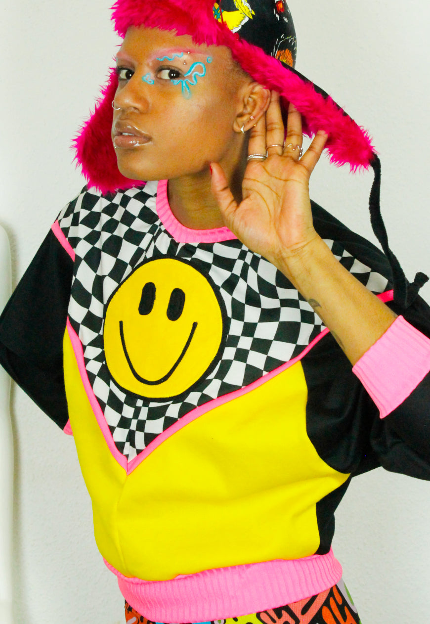 FREEDOM Checkerboard and yellow batwing sweat with 90’s smile detail and neon trim