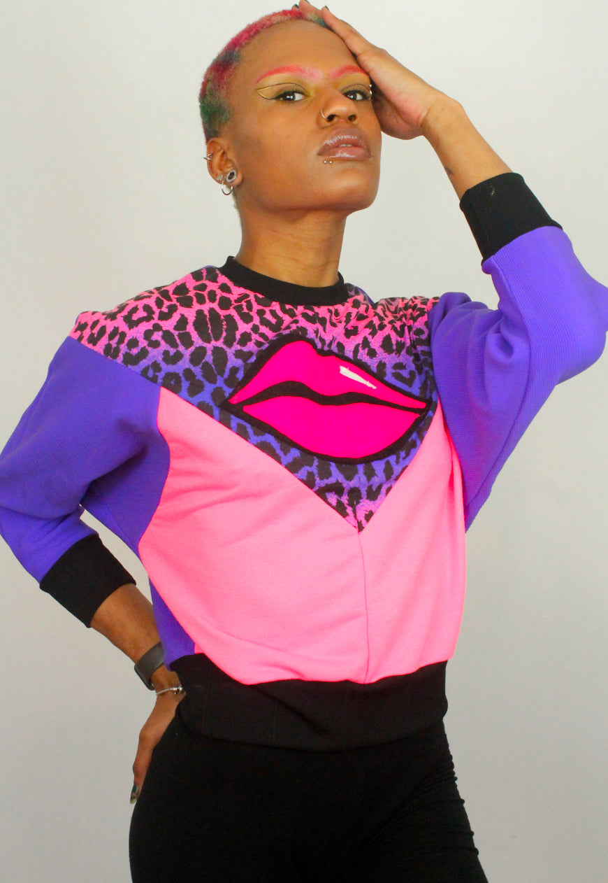Juicy Kisses - Leopard batwing sweater with lips applique.