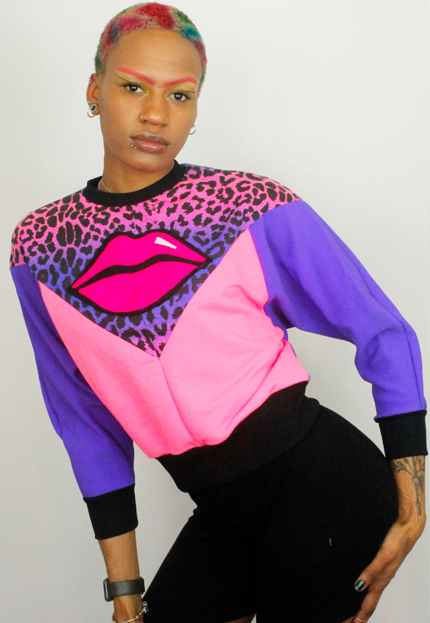 Juicy Kisses - Leopard batwing sweater with lips applique.