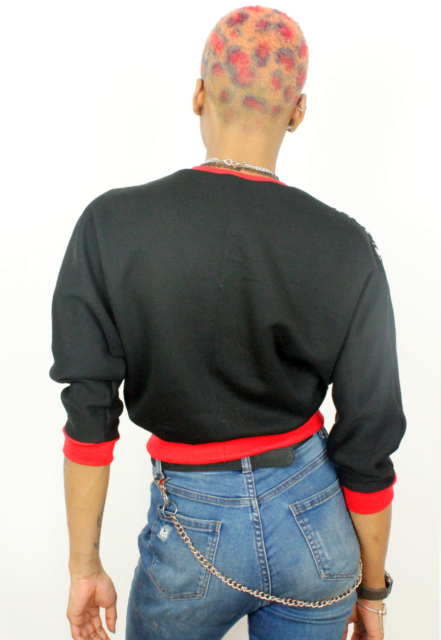 Kiss chase - Houndstooth, red and white batwing sweater with red lips.