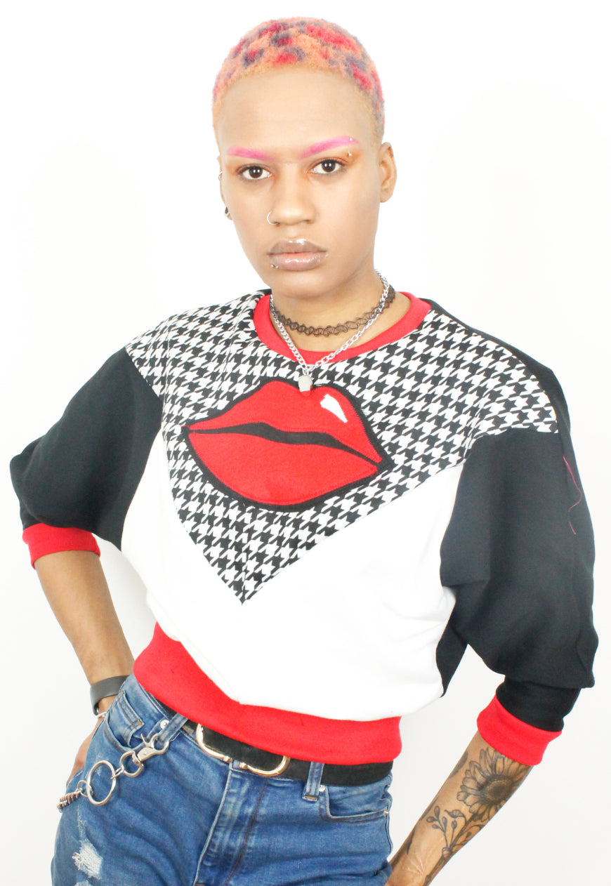 Kiss chase - Houndstooth, red and white batwing sweater with red lips.