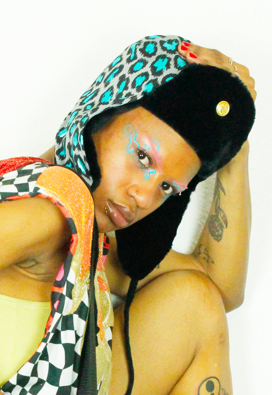 LEO Metallic Blue leopard trapper hat with black faux fur lining