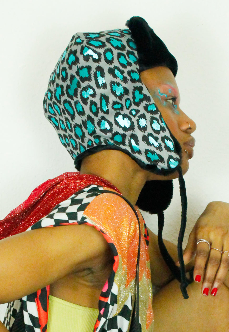 LEO Metallic Blue leopard trapper hat with black faux fur lining