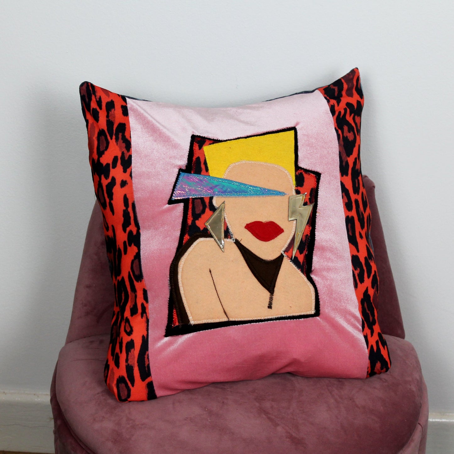 Sweet Dreams - handmade decorative throw cushion in pink and red leopard print with 80’s face appliqué.
