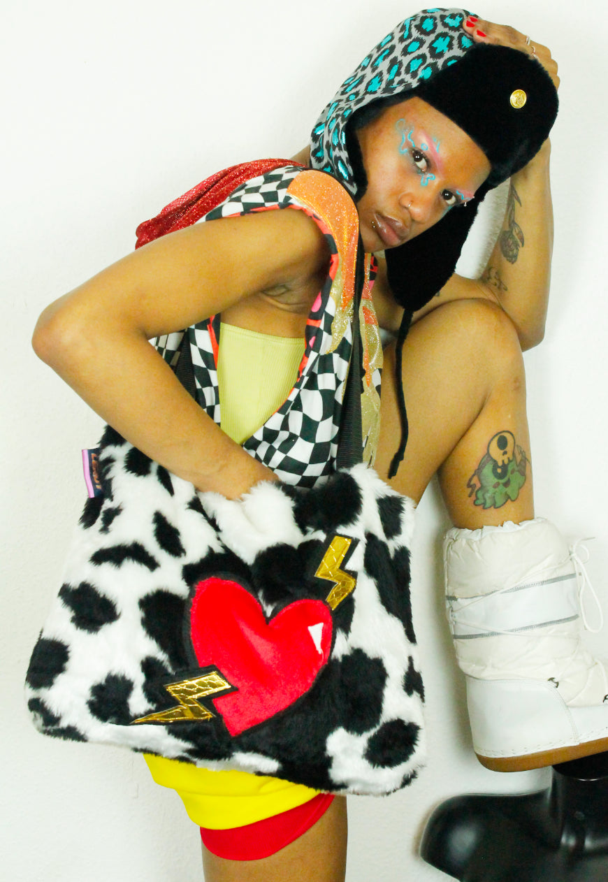 MILKSHAKE Faux fur cow print oversize tote bag with heart and lightning bolts