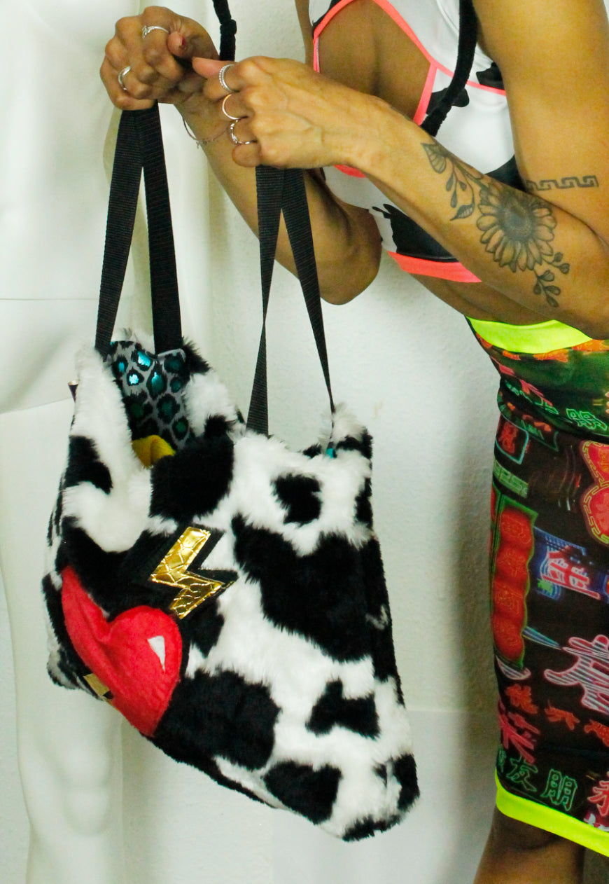 MILKSHAKE Faux fur cow print oversize tote bag with heart and lightning bolts