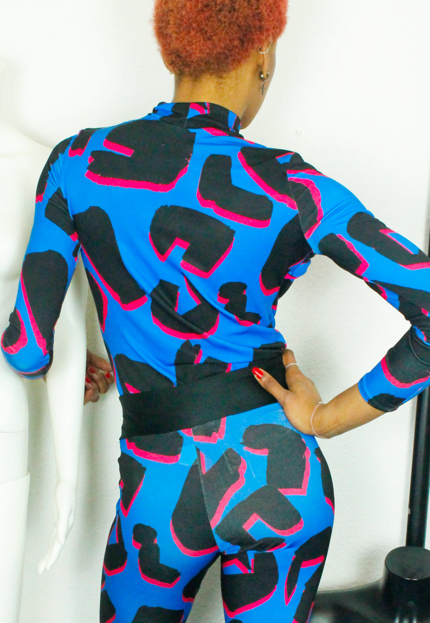 PANTHER TOP Blue and pink abstract leopard print peekaboo top