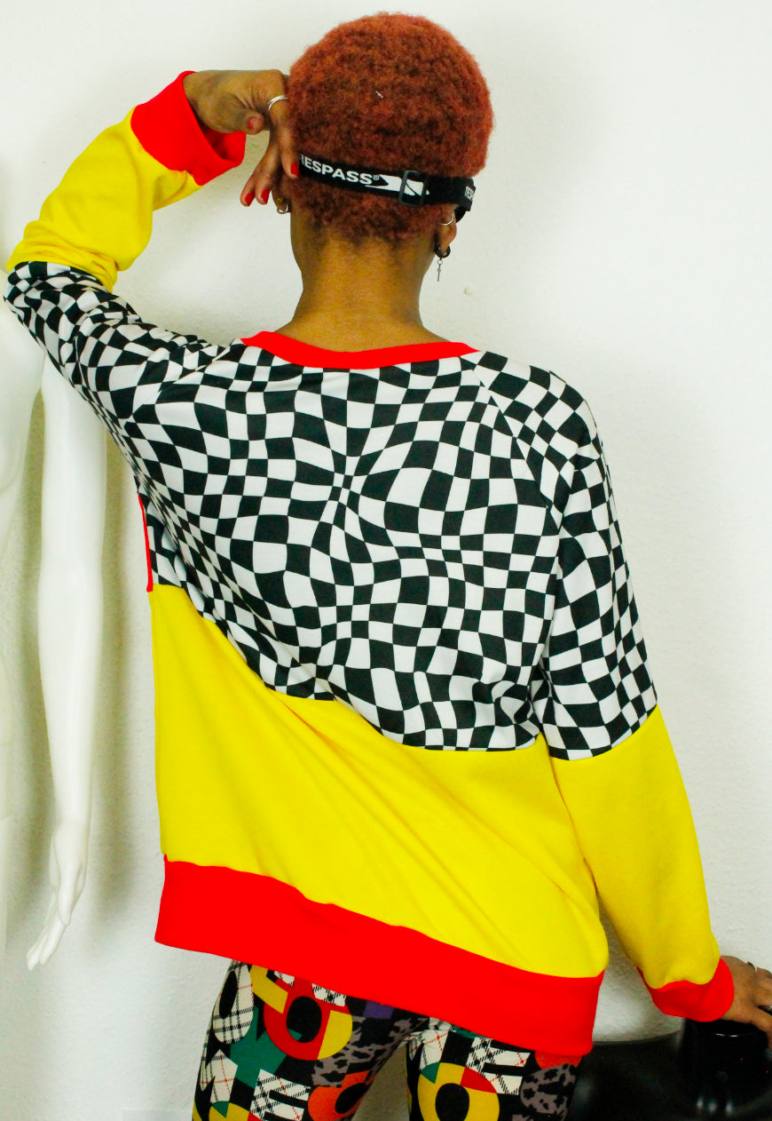 QUIRKY Logo panel yellow, red and checkerboard oversized sweater
