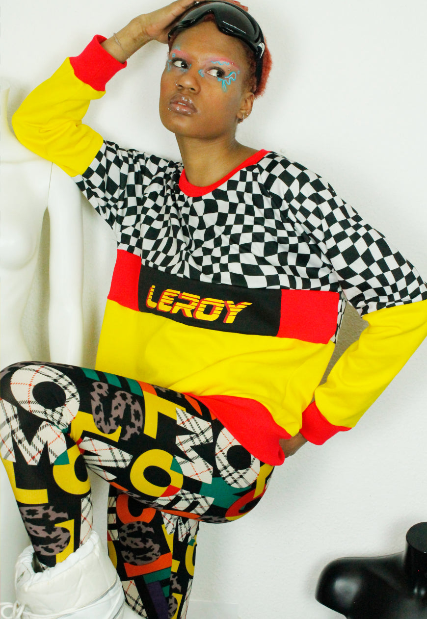 QUIRKY Logo panel yellow, red and checkerboard oversized sweater