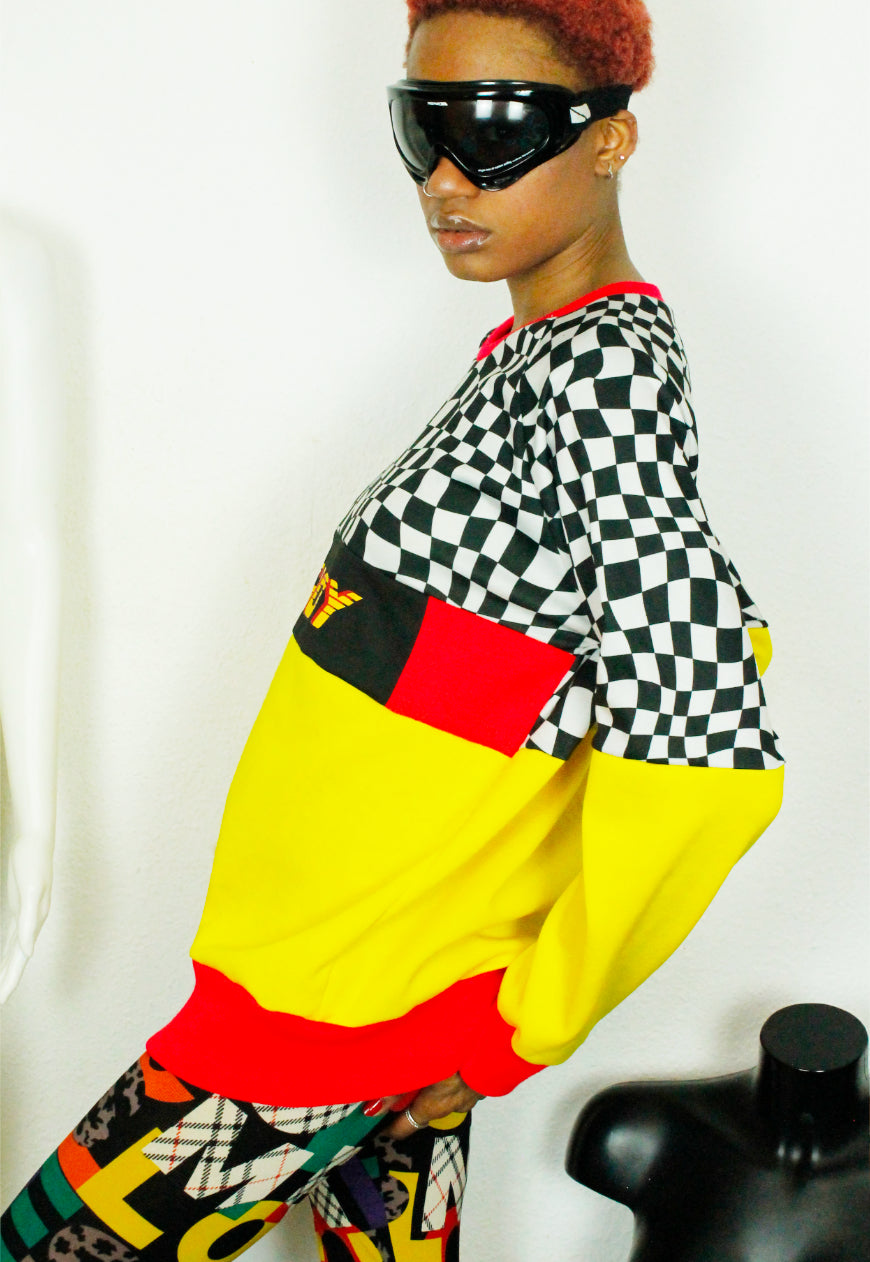 QUIRKY Logo panel yellow, red and checkerboard oversized sweater
