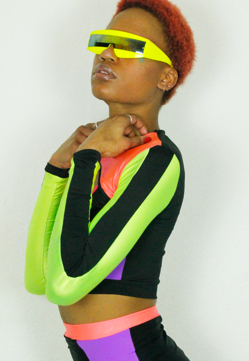 QUIVER Purple, neon and black panel peekaboo top.