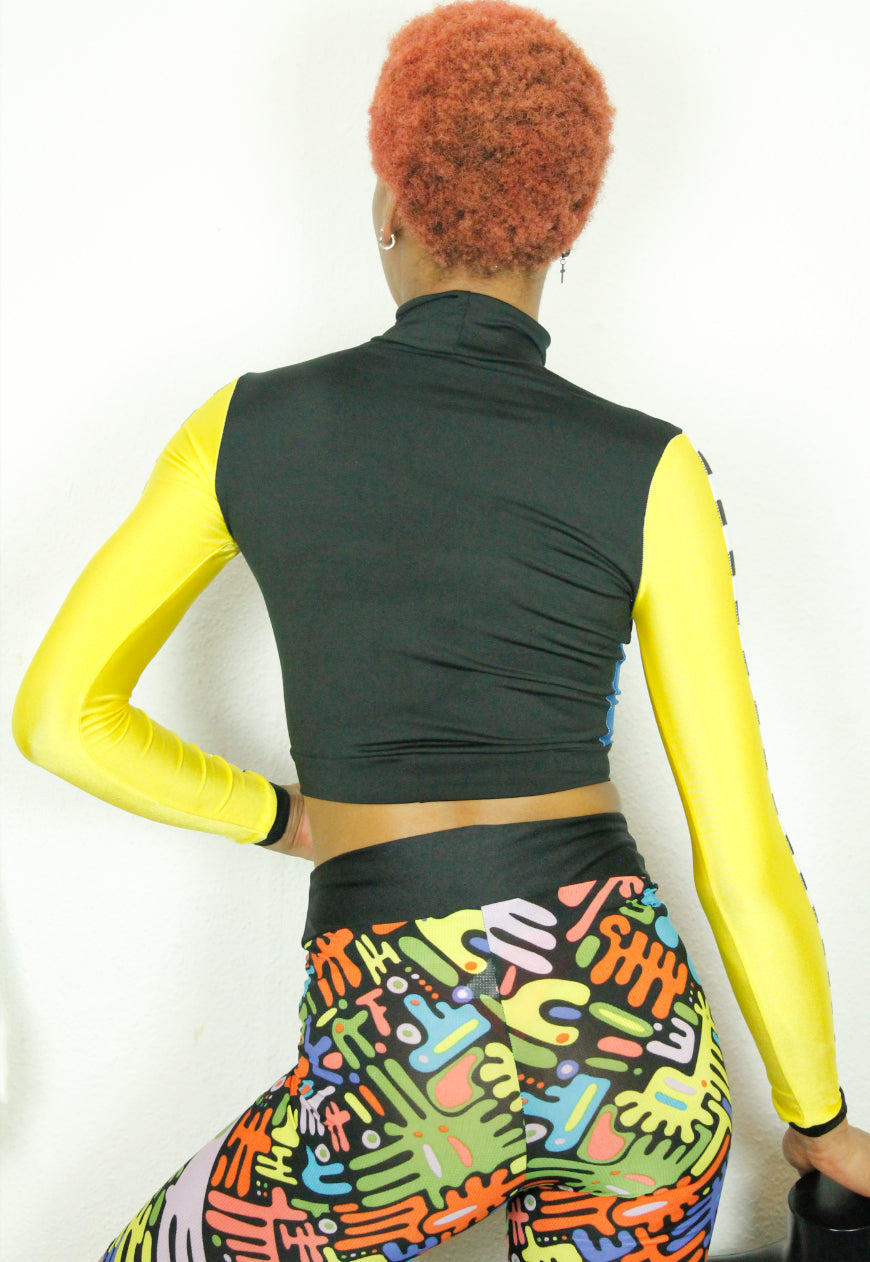 TRAILBLAZER BRIGHT Yellow and blue peekaboo top with checkerboard sleeve detail
