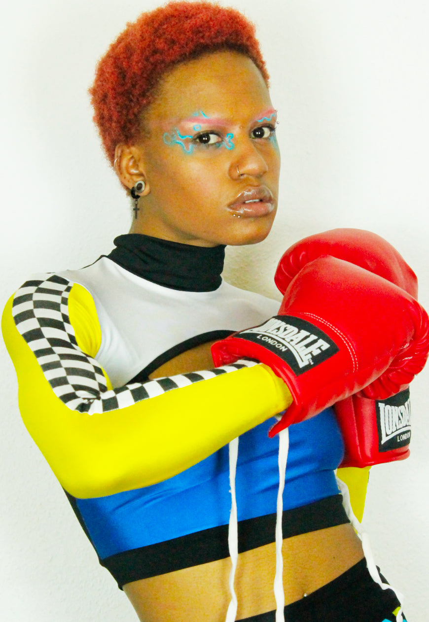 TRAILBLAZER BRIGHT Yellow and blue peekaboo top with checkerboard sleeve detail