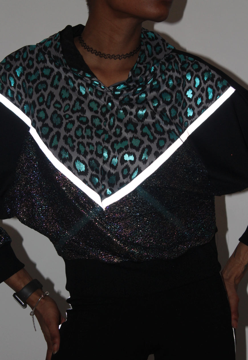 Vortex - Metallic leopard hooded batwing hooded top with reflective strips.