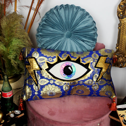 Eye For An Eye - handmade decorative throw cushion with eye appliqué in gold and blue baroque fabric.