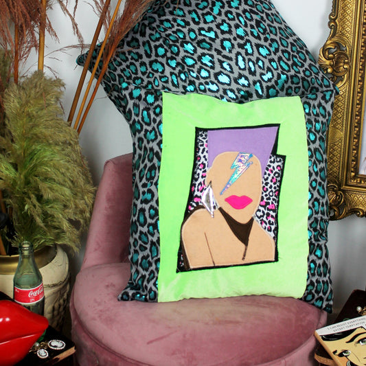 Stardust - handmade throw cushion in neon green and blue leopard print with 80’s face appliqué.