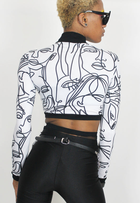 Face Off - Long sleeved white crop top with abstract face print