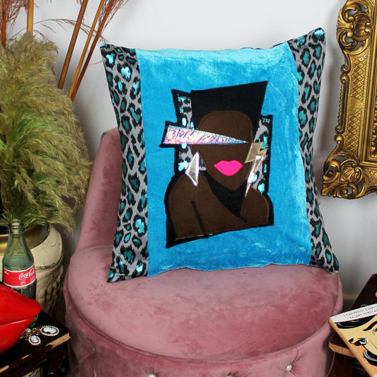 Libertango - handmade throw cushion in blue velvet and blue leopard print with 80’s Grace Jones face appliqué.