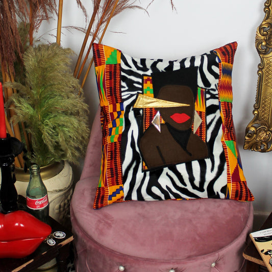 Traveller - decorative throw cushion in zebra and kente with Grace Jones design