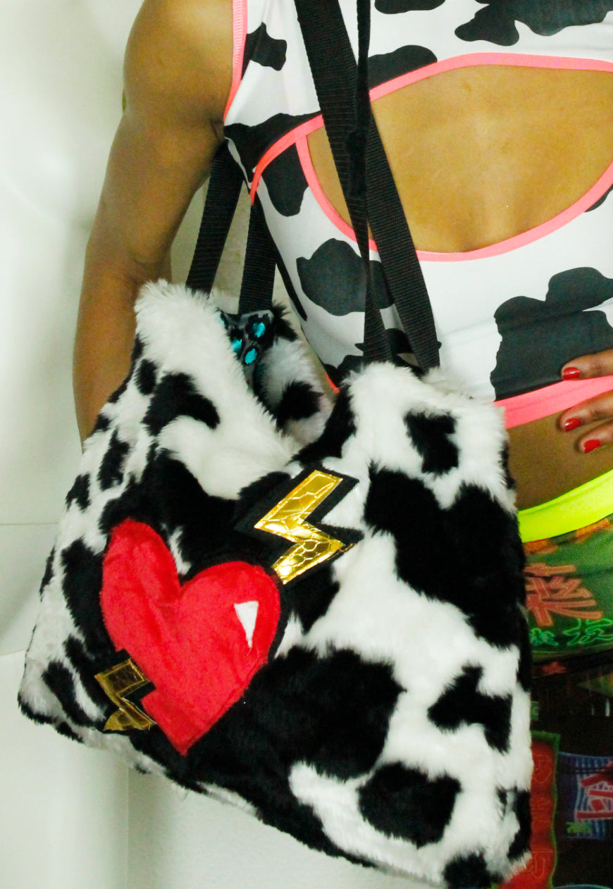 MILKSHAKE Faux fur cow print oversize tote bag with heart and lightning bolts